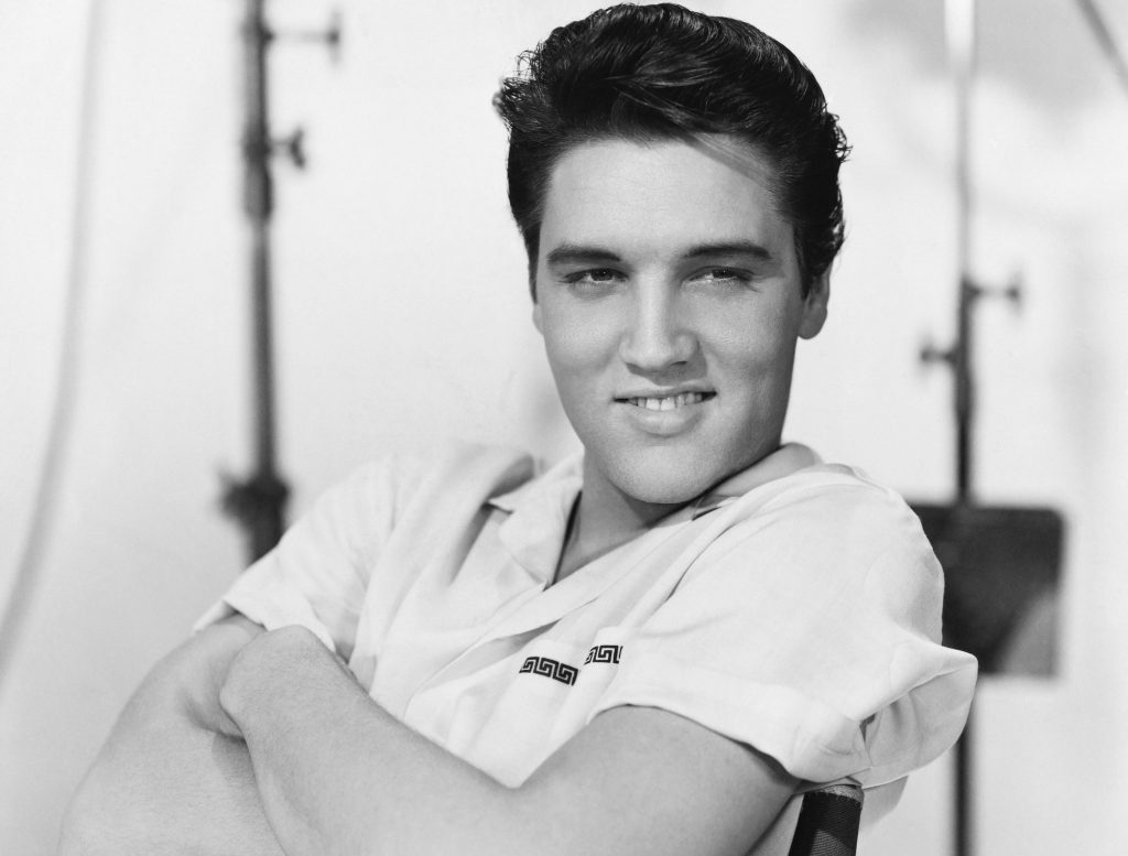 Elvis Presley grinning in 1958. 