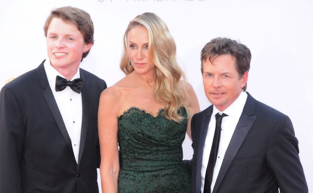 Michael J. Fox with son Sam Fox, and wife Tracy Pollan pose on red carpet at 64th Primetime Emmy Awards