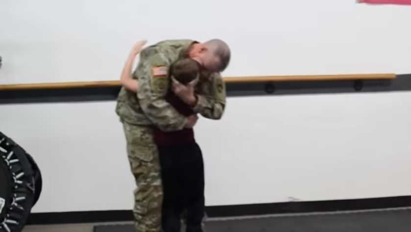boy spars with deployed dad