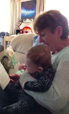 grandmother reading to grandson