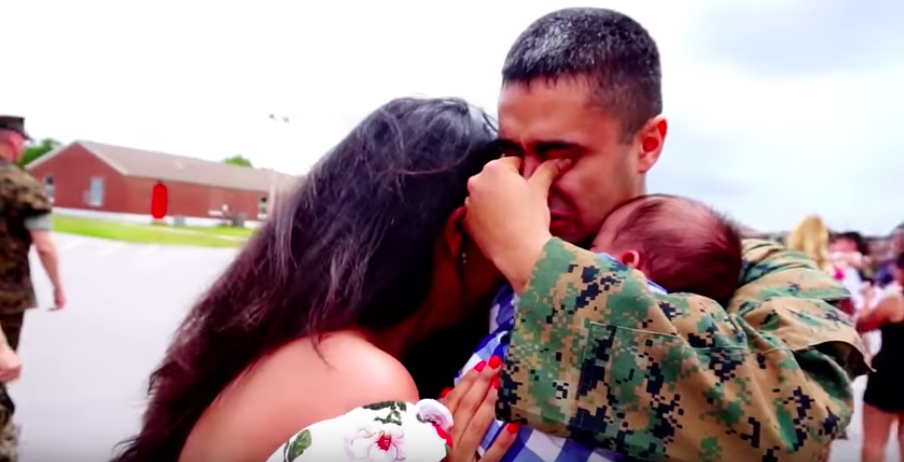 Marine meeting newborn son for the first time