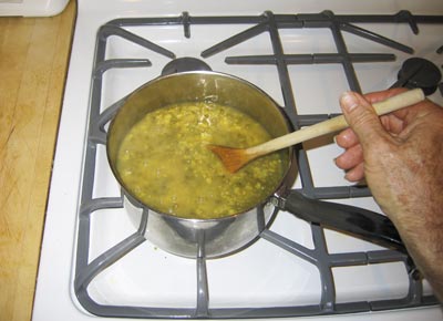 Cooking with a wooden spoon 