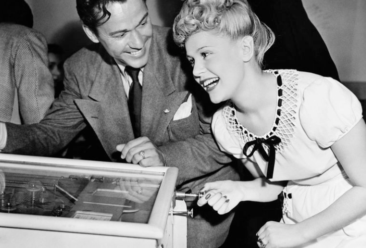 Couple playing Pinball in the 40s/50s