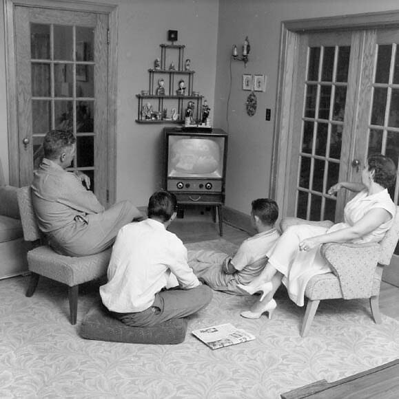 family watching television together 