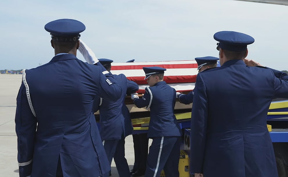 Carrying the late war vet's casket out