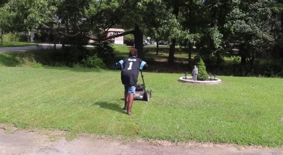 jaylin mowing the lawn 