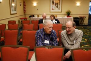 Francis Currey (L) speaking with Holocaust survivor Micah Tomkiewicz (R) at a 30th Infantry Division reunion in 2010