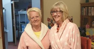 Employees at the Old Vicarage Nursing Home wear pajamas to help seniors relax