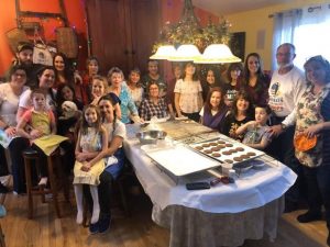 Volunteers and friends come together to bake cookies for the troops
