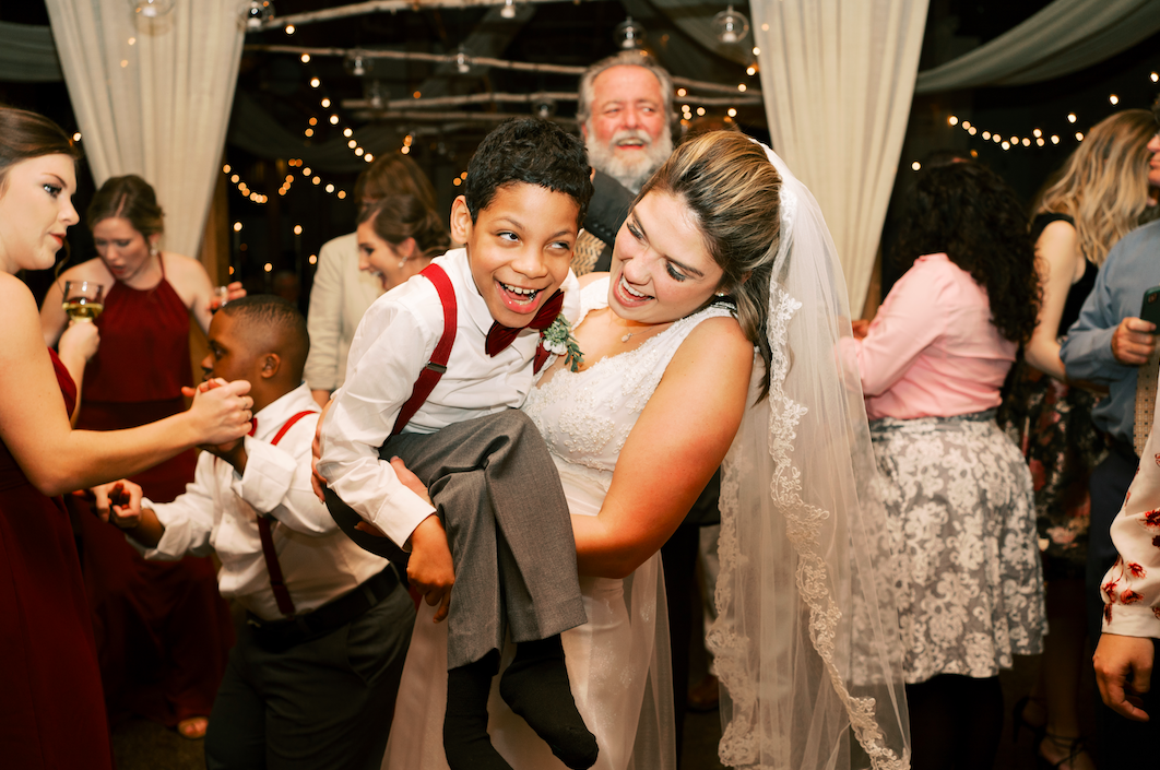 students with disabilities walk teacher down the aisle at her wedding