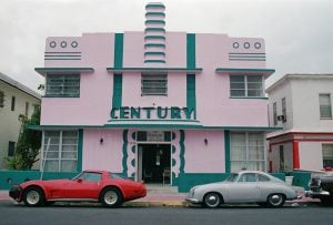 The iconic Century Hotel stands with unique paint details and cars of the era