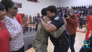 U.S. Army Spc. Shakir Aquil and Officer L.J. Williamson exchanged their first heartfelt hug in two years when he was last in America
