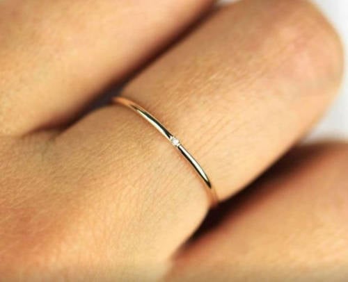 Women Mock Bride's Tiny Engagement Ring, Comparing It To A Keyring