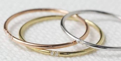 Women Mock Bride's Tiny Engagement Ring, Comparing It To A Keyring