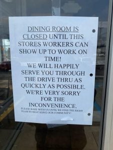 Taco Bell management closed the dining area and posted a sign calling out employees who arrived late