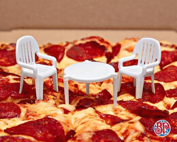 pizza company adds little chairs to little pizza table