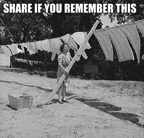 nostalgic photo of person putting clothes on clothespins