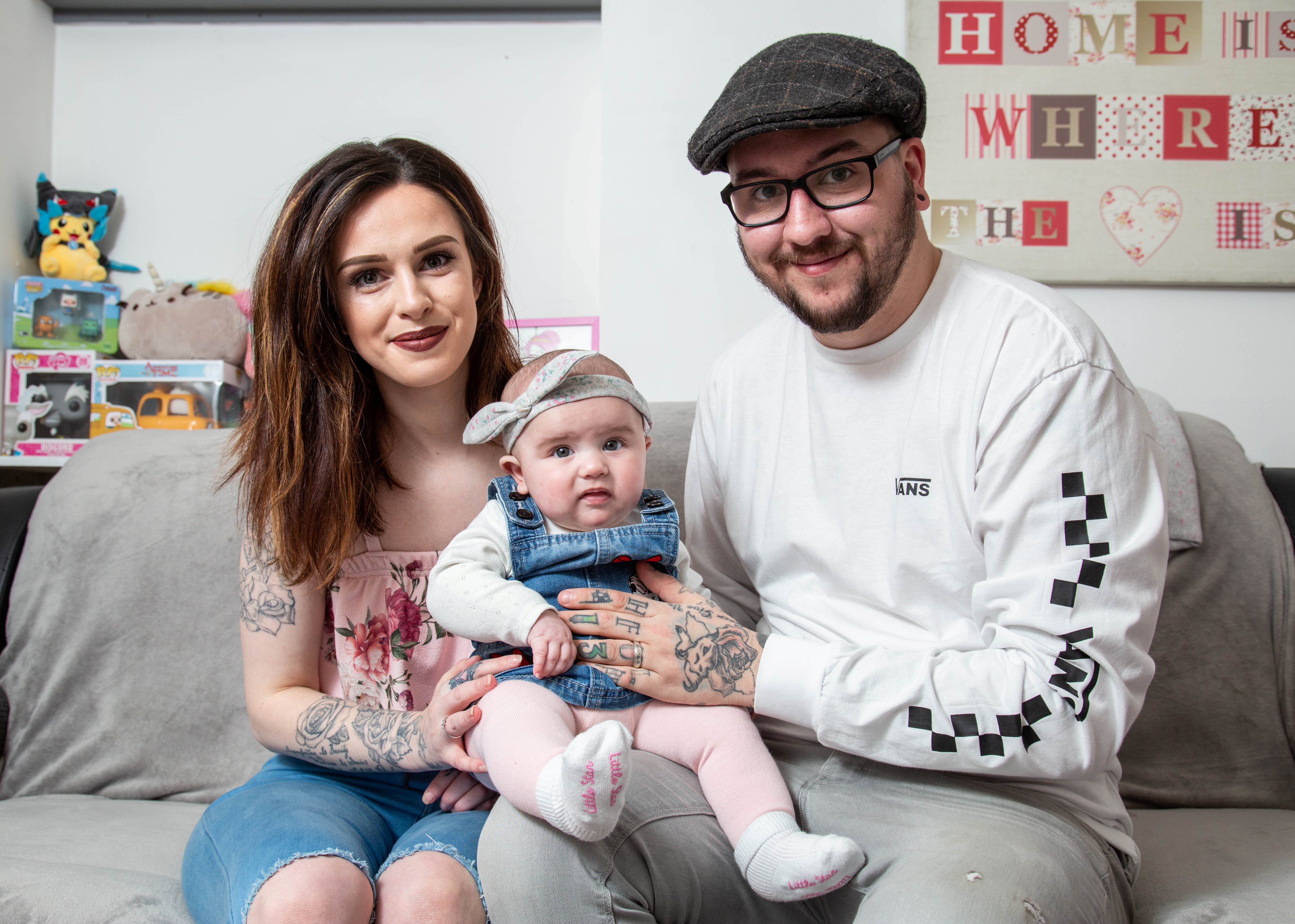 mom and dad with baby Disney