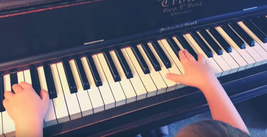 blind boy playing piano