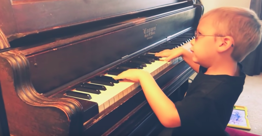 blind boy playing piano