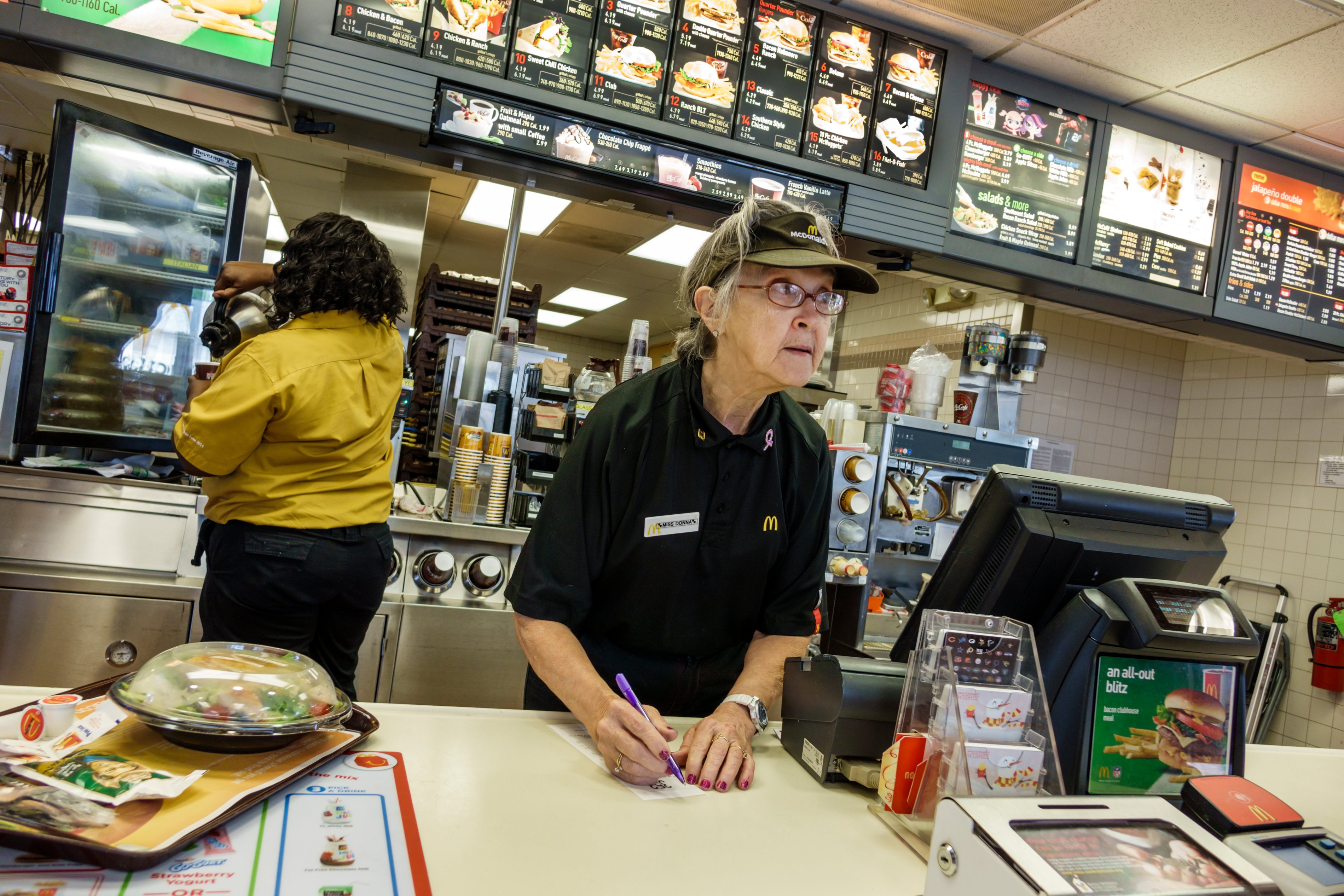 senior woman working at mcdonalds