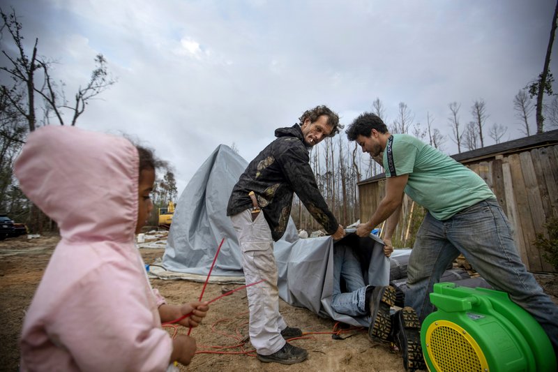 Hurricane Michael victims helping out 