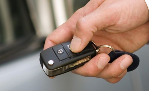 Person pressing on a key fob