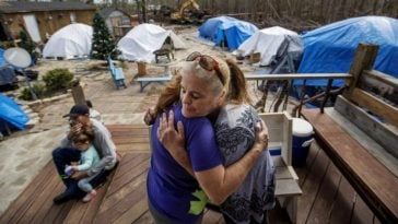 woman helps victims of hurricane michael with tent community
