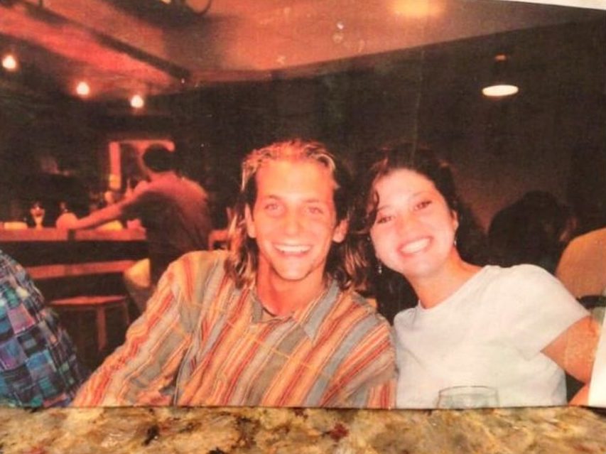 young Bradley Cooper posing with a girl