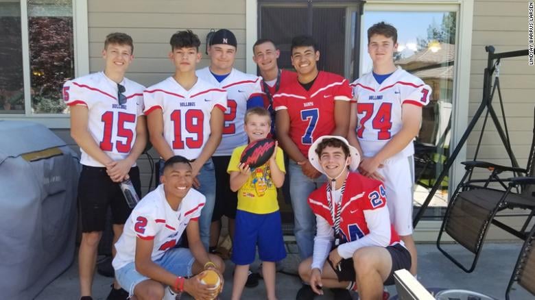 boy with autism celebrates birthday with football team