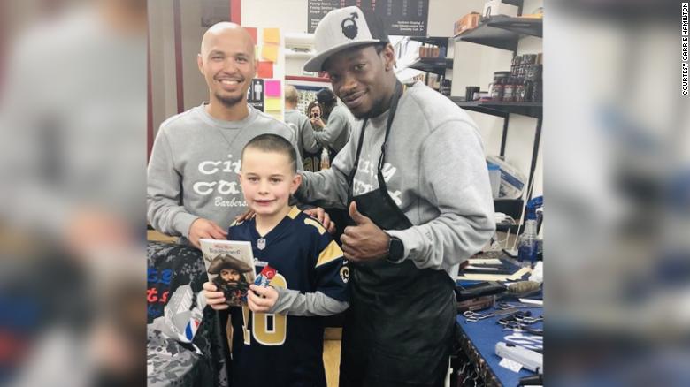 barber pays kids who read books during haircut