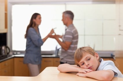 Sad kid listening to parents fight, secondhand drinking