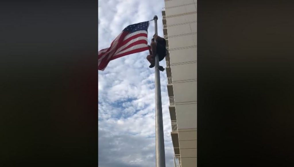 Veteran Climbs Flagpole To Fix American Flag At Navy SEAL Monument