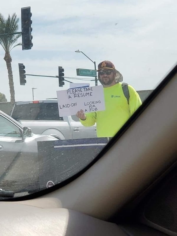 Patrick Hoagland standing outside with resumes