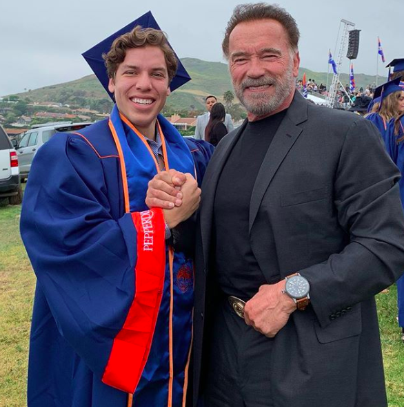 Arnold Schwarzenegger and his son graduation