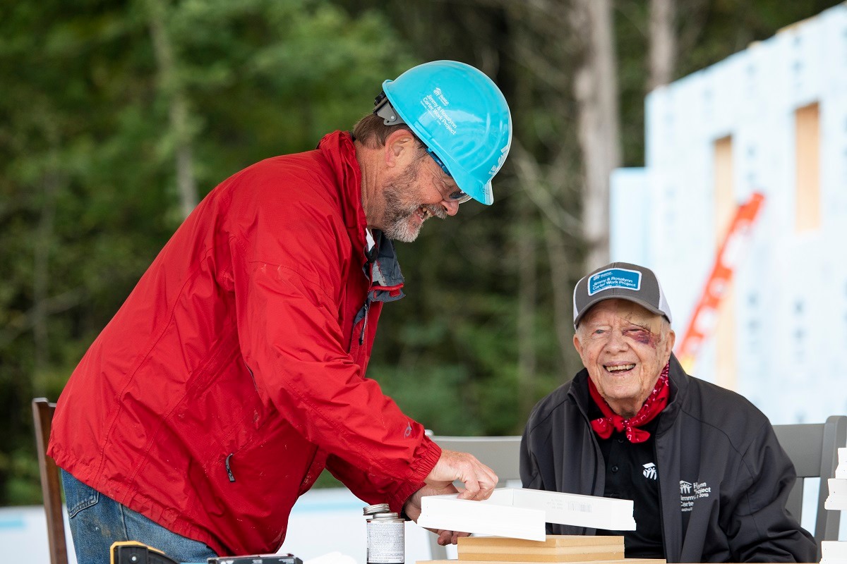 jimmy carter builds homes with black eye and stitches