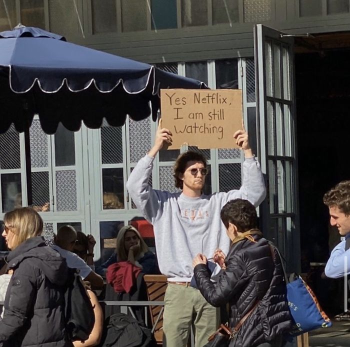 Man Holds Cardboard Signs Protesting Everyday Annoying Things