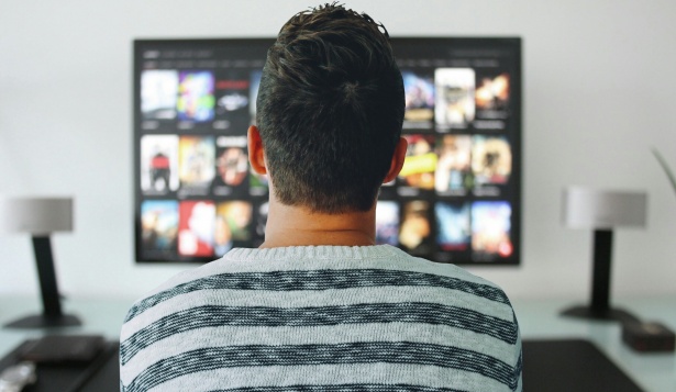 young man watching television 