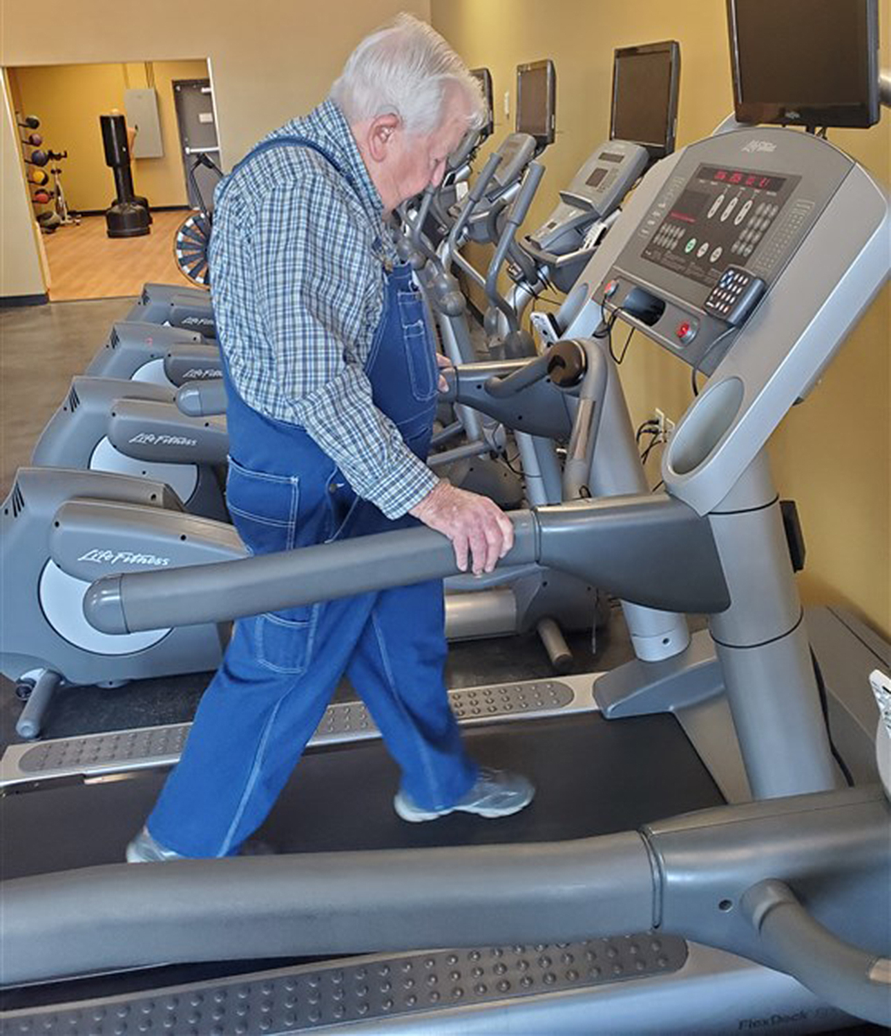 lloyd black exercises in overalls 3 times a week at his gym