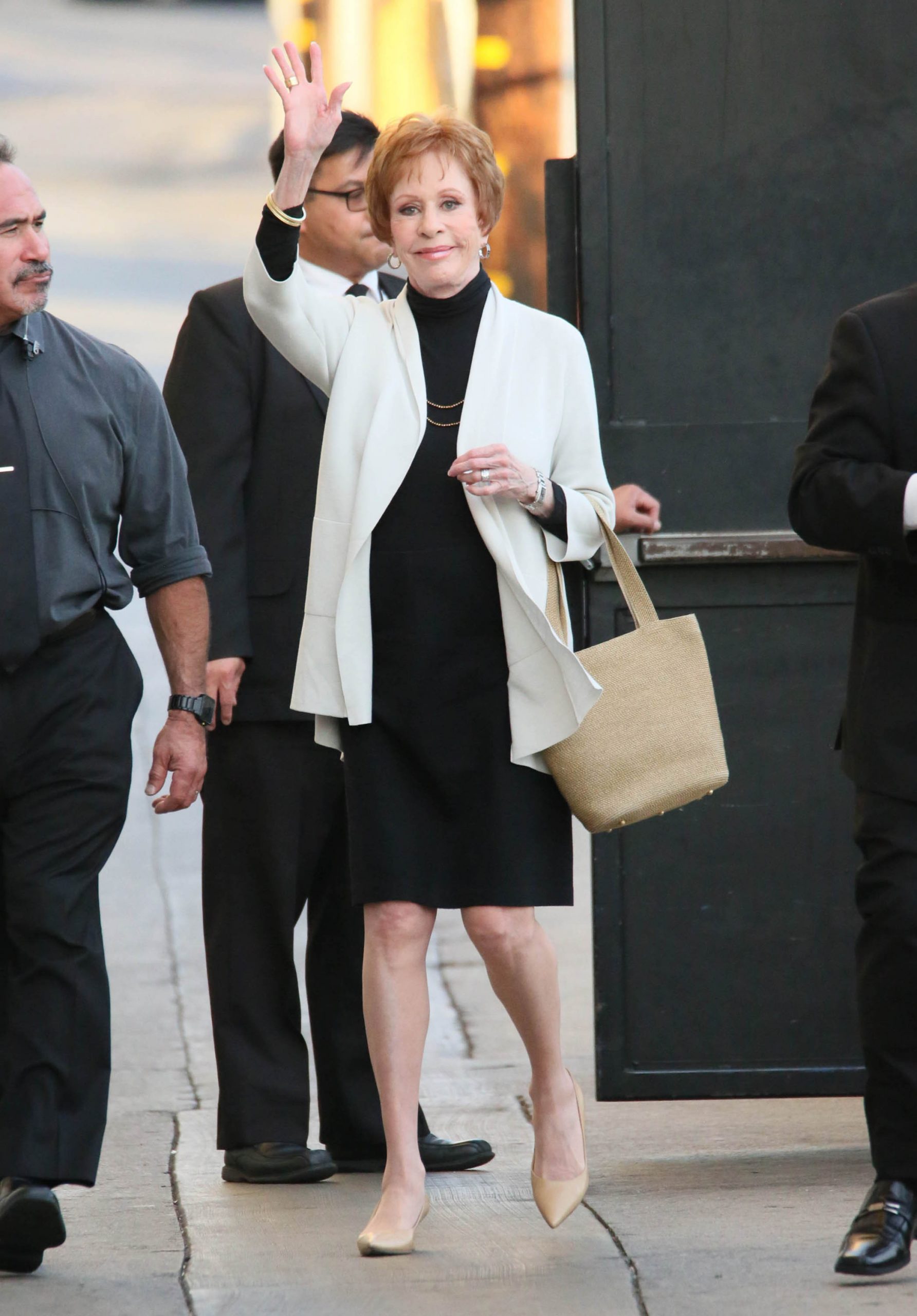 carol burnett walking down the street waving