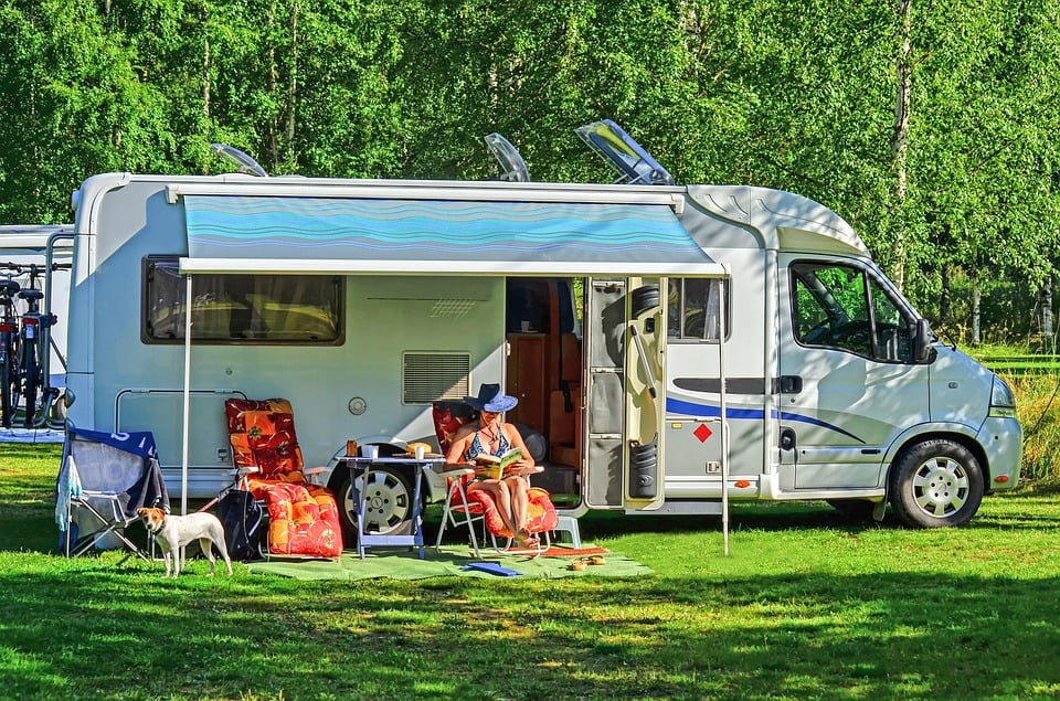 person sitting outside rv 