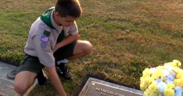 Andrew Baker cleans veterans' graves