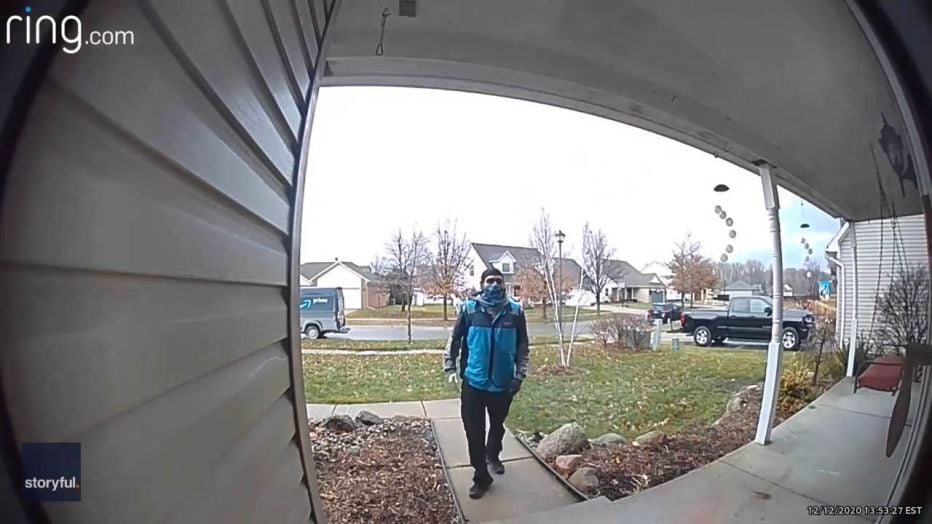 Delivery Driver Shows Respect To Home Of U.S. Air Force Member