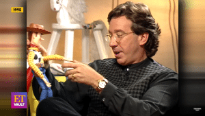 Tim Allen with a toy of Sheriff Woody