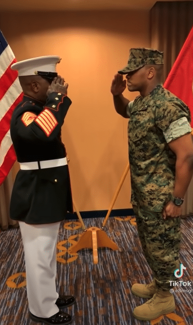 Marine father and son salute each other