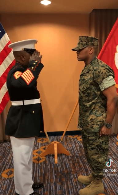 Father gives his son military salute