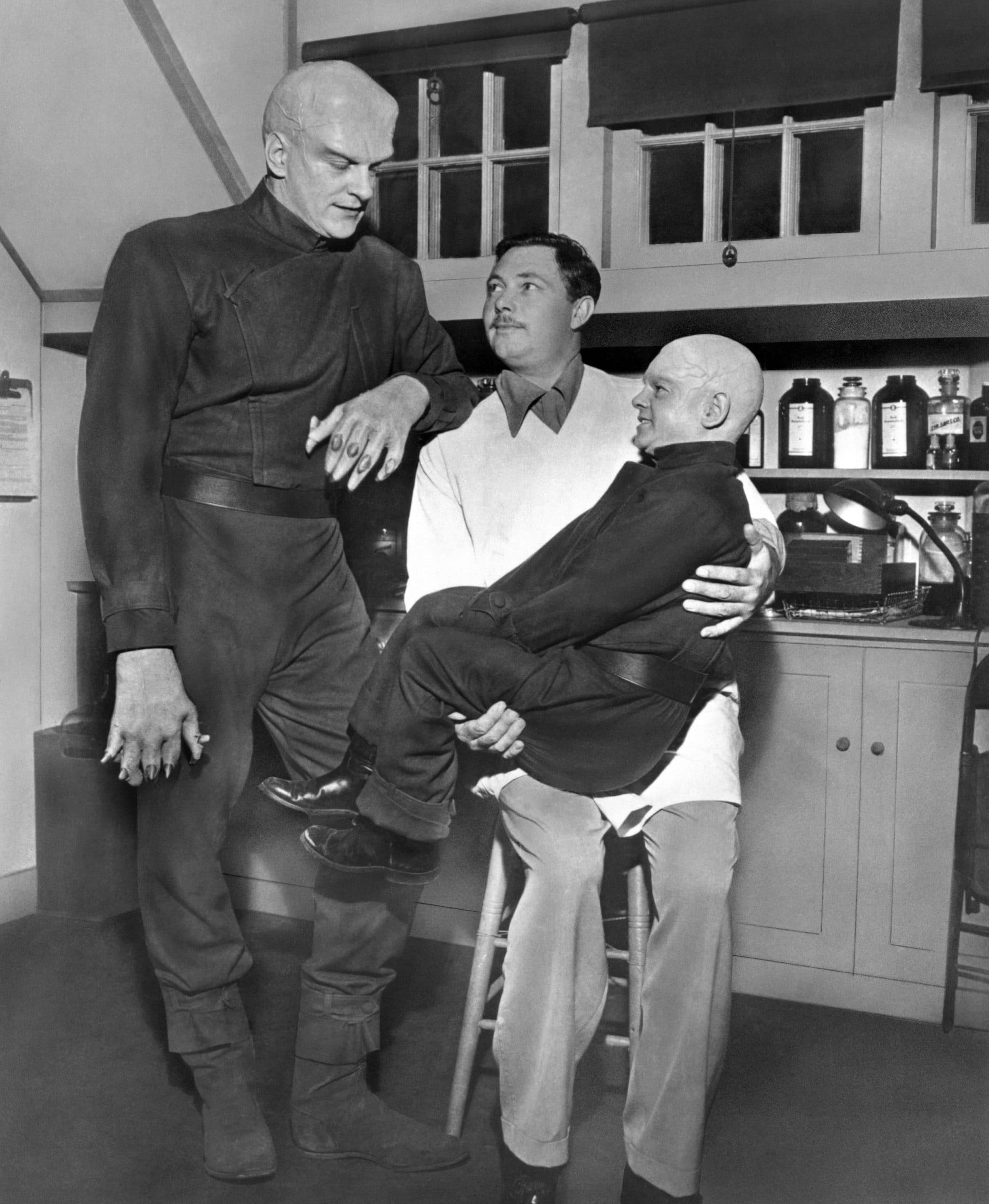 THE THING FROM ANOTHER WORLD, from left: James Arness, make-up artist Lee Greenway, Billy Curtis, on-set, 1951