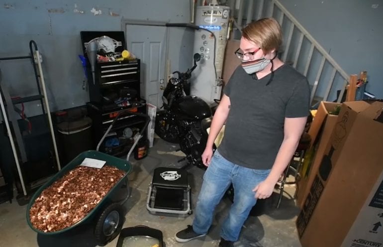 man receives last paycheck in oily pennies