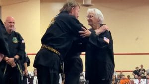 Chuck Norris presents 83-year-old grandma Carole Taylor with a black belt - and hug