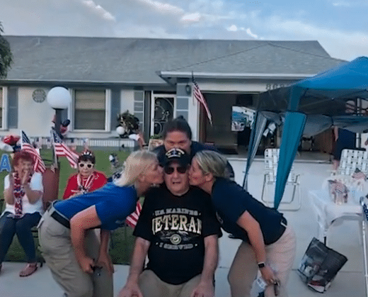 Peter Ruvolo surrounded by Young Marines members